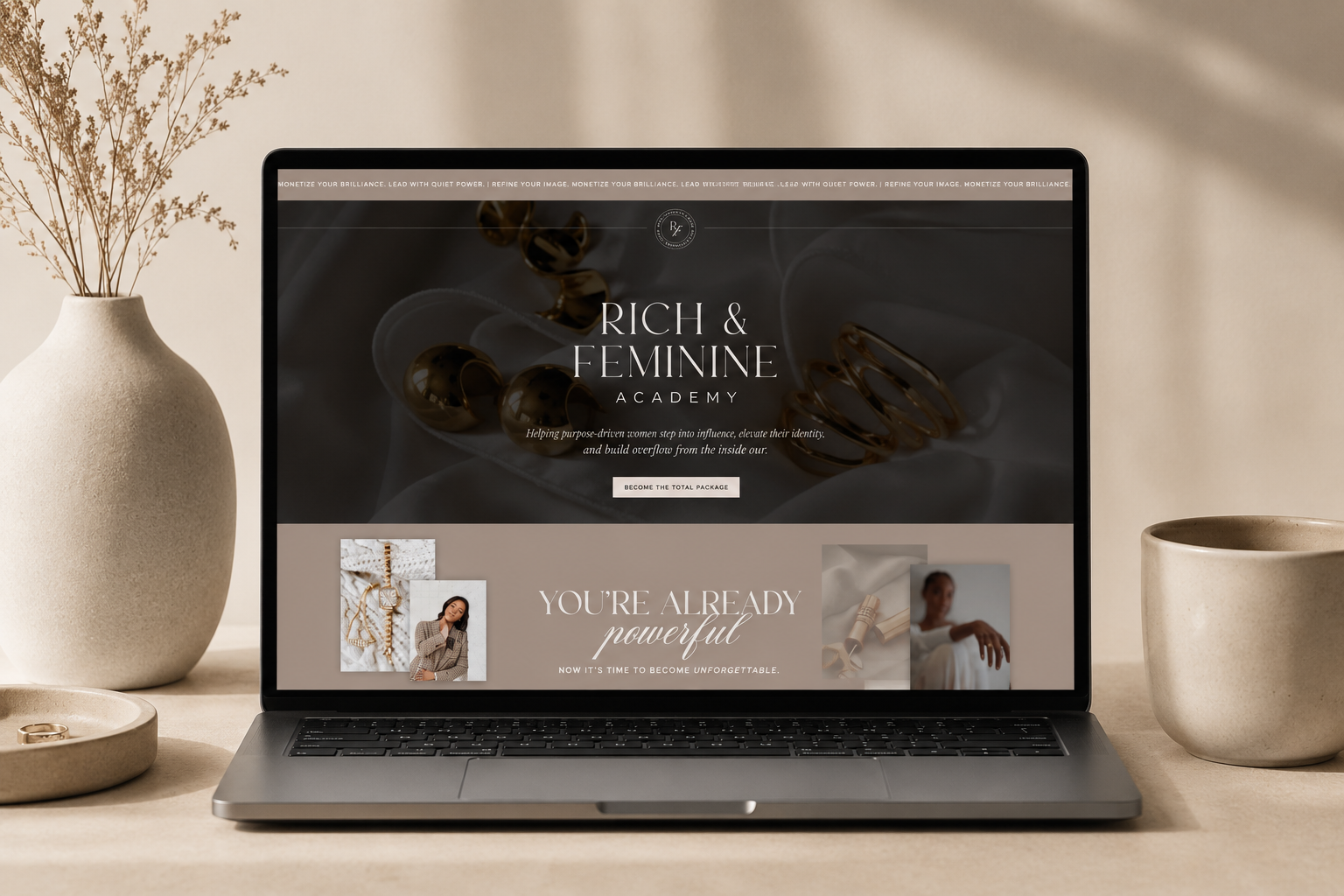 Laptop displaying the Rich & Feminine Academy custom Showit website on a neutral beige desktop with minimalist decor.